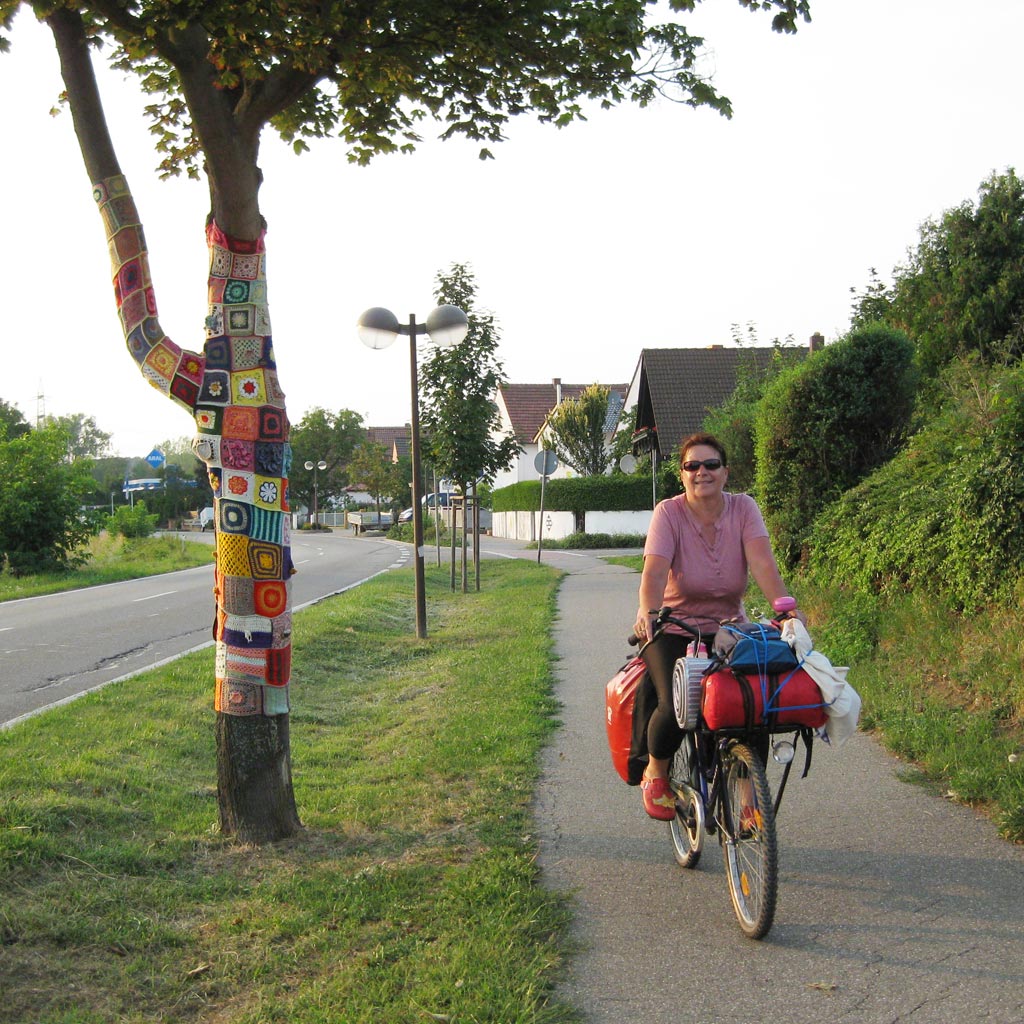 My Mom riding her bicycle.