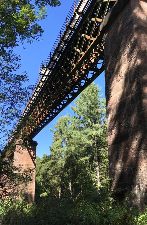 A tall railroad bridge.