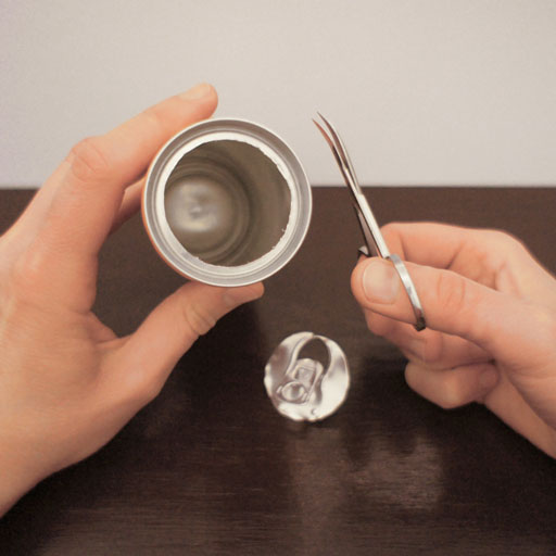 A soda can with the lid cut out.